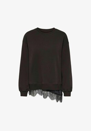 Sweat-shirt noir à manches longues avec poignets et ourlet côtelés, avec une bordure en dentelle noire asymétrique dépassant du bas.