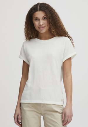 Top corto bianco con maniche a cuffia arrotolata, tessuto a maglia strutturata, scollatura rotonda e un piccolo logo sulla parte inferiore dell'orlo.