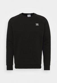 Svart sweatshirt i en bomullsblandning med rund hals, långa raglanärmar och en liten vit Adidas-logotyp på bröstet.