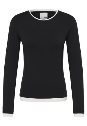 Chemise noire ajustée à manches longues avec bordure blanche sur le col, les poignets et l'ourlet, étiquetée "ICHI" sur l'étiquette intérieure du cou.