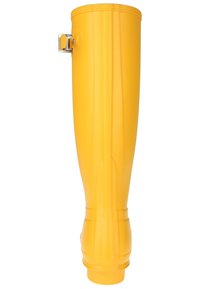 Botte en caoutchouc jaune au design épuré, texture lisse et boucle sur le côté. La base est légèrement plus large avec des détails nervurés.