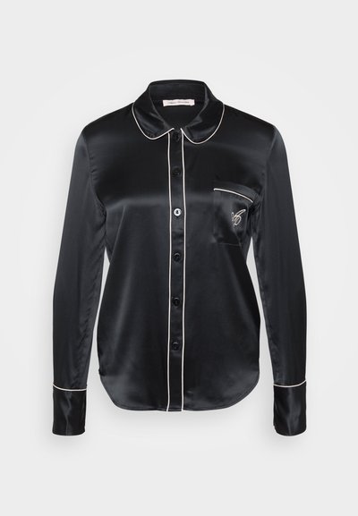 Black satin shirt with a collar, long sleeves, and button front. Features white piping along the collar and pocket, with an embroidered detail.
