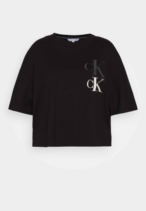 Zwart cropped T-shirt gemaakt van katoen, met een groot "CK"-logo in contrasterende kleuren aan de voorkant, korte mouwen en een ronde hals.