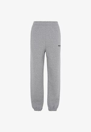 Pantaloni della tuta grigi realizzati in tessuto morbido, con vita e polsini elasticizzati, caratterizzati da un piccolo logo nero sulla coscia sinistra.