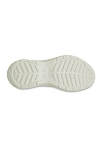 White rubber outsole with a textured tread pattern featuring grooves and raised details for grip and flexibility.