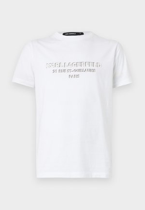 T-shirt in cotone bianco con testo in rilievo: "KARL LAGERFELD 21 RUE ST-GUILLAUME PARIS." Collo a girocollo classico e maniche corte.