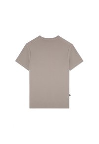 Koszulka z krótkim rękawem w jasnym beżu, wykonana z miękkiej bawełny. Posiada okrągły dekolt, prosty dół oraz małą metkę z logo z boku.