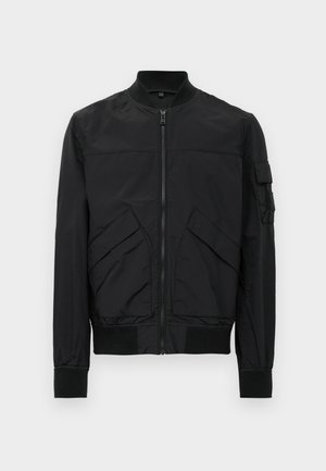 Black bomber jacket with a zip front, ribbed cuffs and hem, two angled front pockets, and a utility-style pocket on the left sleeve.
