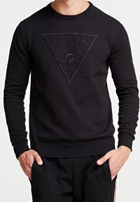 Musta puuvillane sviiter, mille keskel on tekstuuriga kolmnurga logo, soonikud varrastes ja alläärs. Kujundatud ümmarguse kaelusega.
