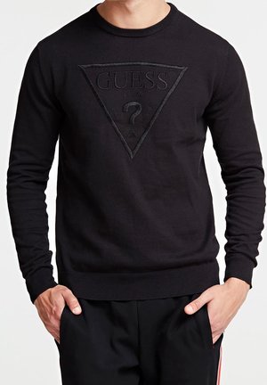 Zwarte katoenen trui met een textuur driehoek logo in het midden, geribbelde mouwen en zoom. Gestyled met een ronde halslijn.