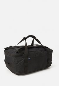 Black duffel bag in nylon, featuring dual handles and a zip closure, with a small Swedish flag label. Rectangular shape with a smooth texture.