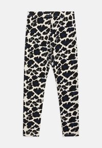Leggings à motifs avec un imprimé léopard noir, bleu et gris sur fond blanc, fabriqués en tissu extensible et doux.