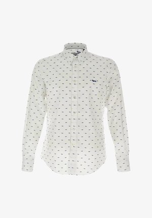 Chemise blanche à boutons avec de petits motifs de chiens bleus, à manches longues et col classique. Fabriquée en tissu léger.