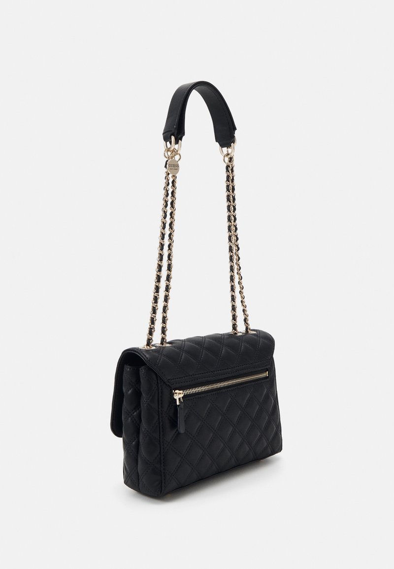 Black quilted handbag with a gold-tone chain strap and zipper detail. Features a structured shape and flap closure. Smooth texture throughout.