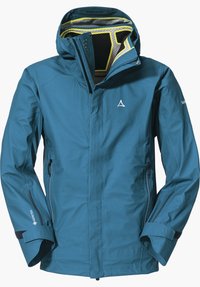 Giacca impermeabile color teal con cappuccio, tasche con zip e polsini regolabili. Presenta un design strutturato e tecnologia RECCO per la sicurezza.