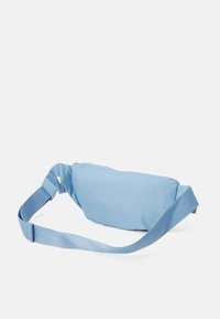 Light blue fabric fanny pack with a smooth texture, rectangular shape, adjustable strap, and buckle closure. Suitable for casual use.