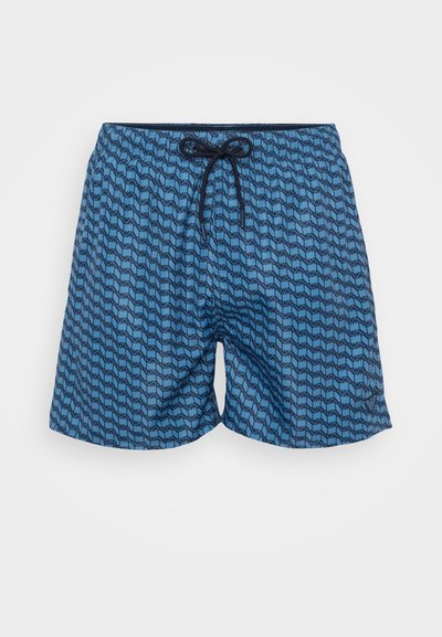 Modré plavky s geometrickým vlnkovým vzorom, elastický pás so námorníckym šnúrkou a ľahká, rýchloschnúca tkanina.