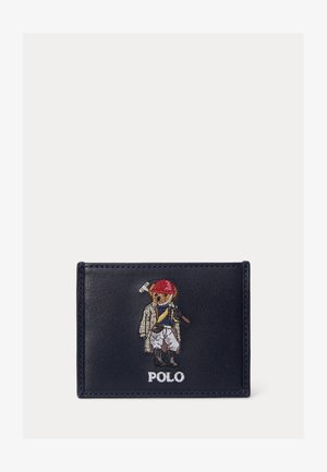 Tamnoplavi kožni novčanik s vezom medvjeda u polo odjeći i kacigi, koji drži palicu, s tekstom "POLO" ispod.