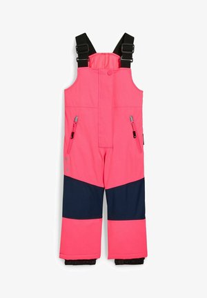 Gepolsterte rosa Schneehose für Kinder mit schwarzen, verstellbaren Schultergurten und marineblauen Kniepatches, ausgestattet mit seitlichen Reißverschlusstaschen.
