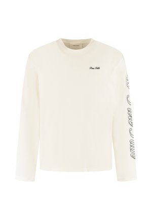 Langsleeve crème shirt van zachte katoen. Heeft een klein geborduurd logo op de borst en gestileerde tekst die langs de mouw is gedrukt.