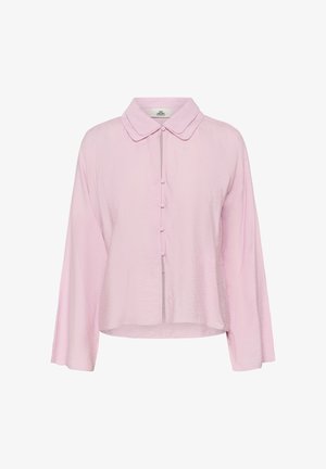 Light pink long-sleeve blouse with rounded collar and five fabric-covered buttons down the front, slightly cropped length.