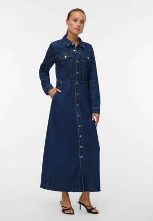 Dunkelblaues Denim-Maxikleid mit Kragen, Knopfleiste, langen Ärmeln und tailliertem Design. Mit seitlichen Taschen.