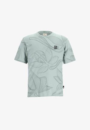 T-shirt verde menta con maniche corte, caratterizzato da un motivo floreale disegnato a linee. Include un piccolo etichetta sul petto e un'etichetta laterale.
