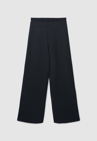 Pantaloni neri a gamba larga con vita alta e design semplice, distesi su uno sfondo grigio chiaro.