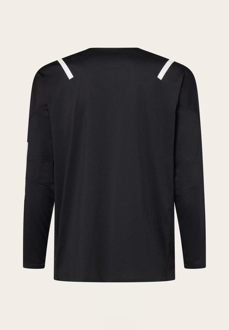 Chemise noire à manches longues avec un col rond, présentant deux bandes diagonales blanches sur les épaules, vue de dos sur un fond clair.