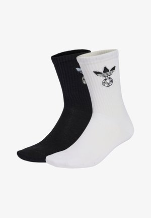 Czarno-białe bawełniane skarpetki za kostkę o prążkowanej fakturze z haftowanymi logo, z motywem piłki nożnej i charakterystycznymi akcentami marki.