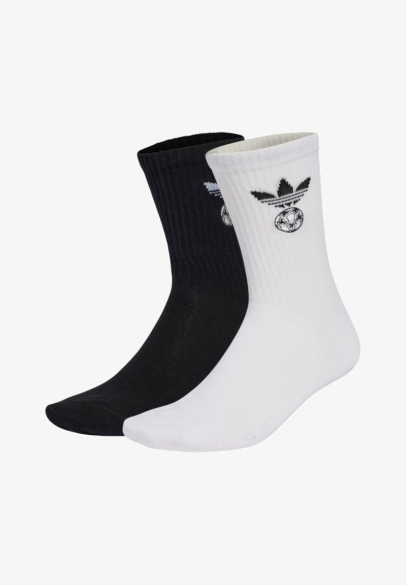 Svarta och vita bomullsstrumpor med ribbad textur och broderade logotyper, med en fotbollsdesign och ikoniska märkesdetaljer.