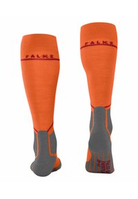 Skarpetki do kolan w jasnym pomarańczowym kolorze z szarymi akcentami. Posiadają logo FALKE, wzmocnioną piętę i palce oraz teksturowany wzór zapewniający przyczepność.