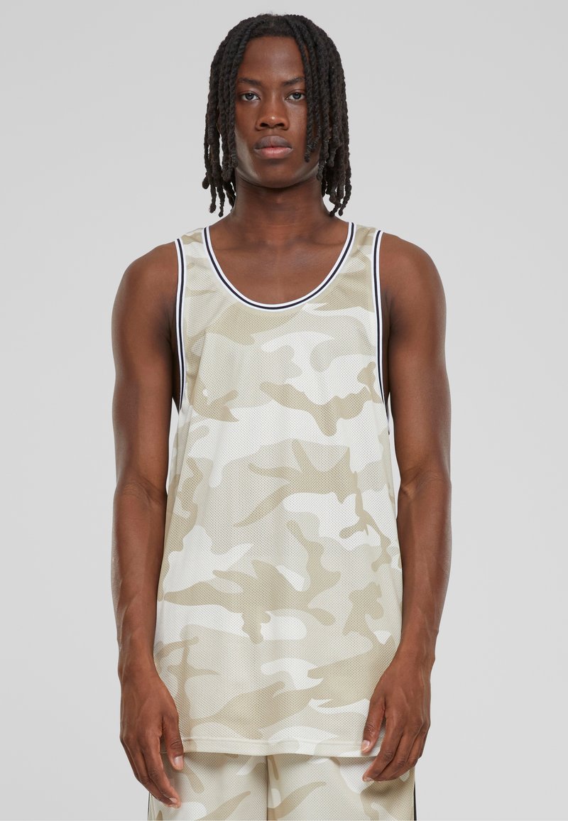 Beige kamuflaažimustriga võrgust tank top, ümmarguse kaelusega, kontrastsete mustade äärtega ja mugava lõikega. Kerged ja hingavad kangad.