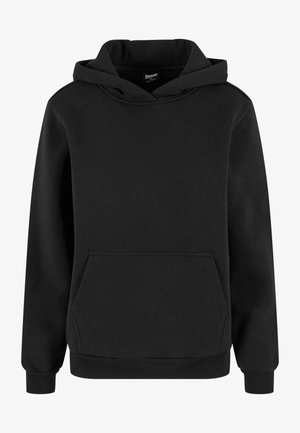 Melnā sporta jakā, kas izgatavota no mīkstas auduma, ir kenguru kabata, ribotās piedurknes un kapuce ar auklu. Vienkāršs, minimālistisks dizains.