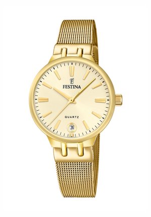 Gold quartz watch with a mesh band, round case, and a light gold dial. Features include hour markers, date display, and crown.