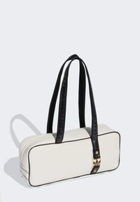 White rectangular handbag with black straps, gold hardware, and contrasting trim. Smooth leather texture with a minimalist design.