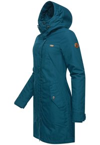 Teal hooded jacket made of durable fabric. Features a zip front, side pockets with flaps, and a logo patch on the sleeve. Smooth texture.