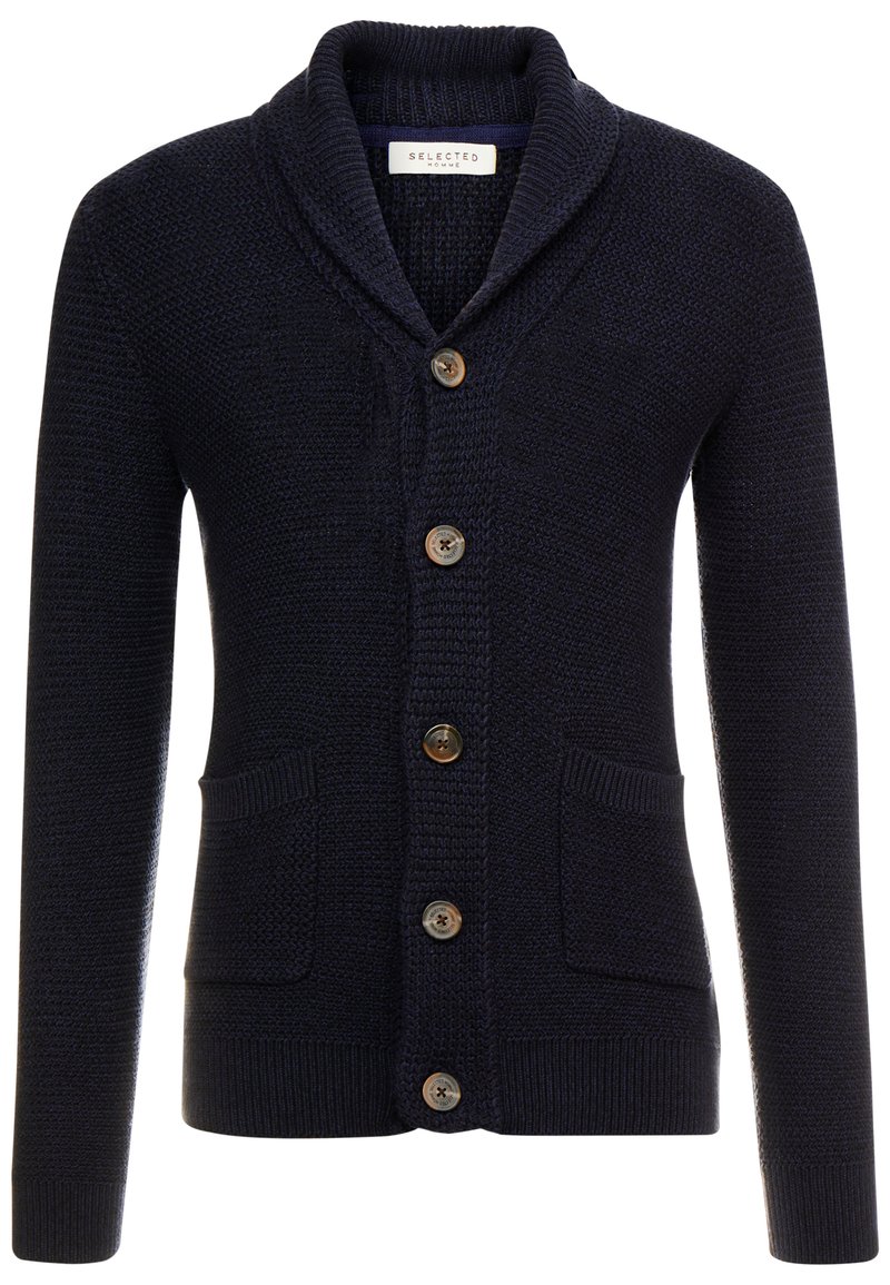 Mörk marinblå stickad cardigan med sjalkrage, fem bruna knappar, två framfickor och ribbade muddar och nederkant.