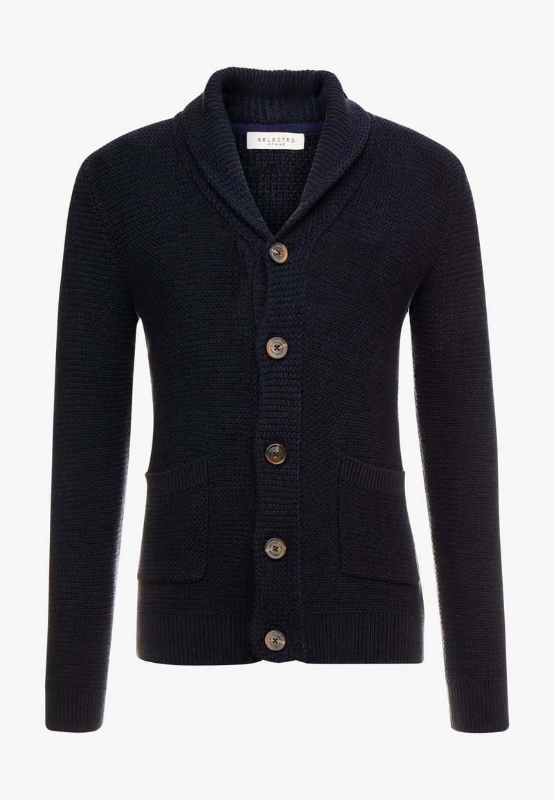Mørk marineblå strikket cardigan med sjalkrage, fem brune knapper, to frontlommer og tekstur med ribbestrikkede mansjetter og kant.