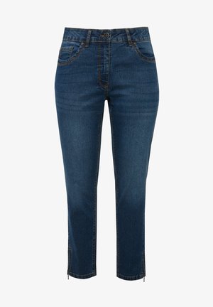 Jeans de mezclilla cropped en azul oscuro con un diseño clásico de cinco bolsillos, costuras de contraste y detalles con cremallera en los dobladillos.