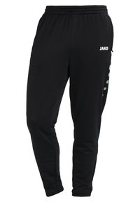 Zwarte sportbroek van zacht stof, met een elastische tailleband, taps toelopende benen en een wit logo aan de voorkant met zijkanten in stippenaccenten.