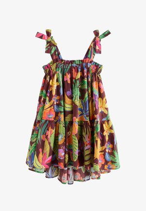 Mouwloze jurk met strikjes op de schouders, met een kleurrijke tropische bloemen- en bladerenprint op een donkerbruine achtergrond.