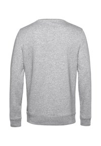 Felpa grigia con collo rotondo, maniche lunghe e orlo a costine. Il tessuto appare morbido con una consistenza liscia e cuciture minime.