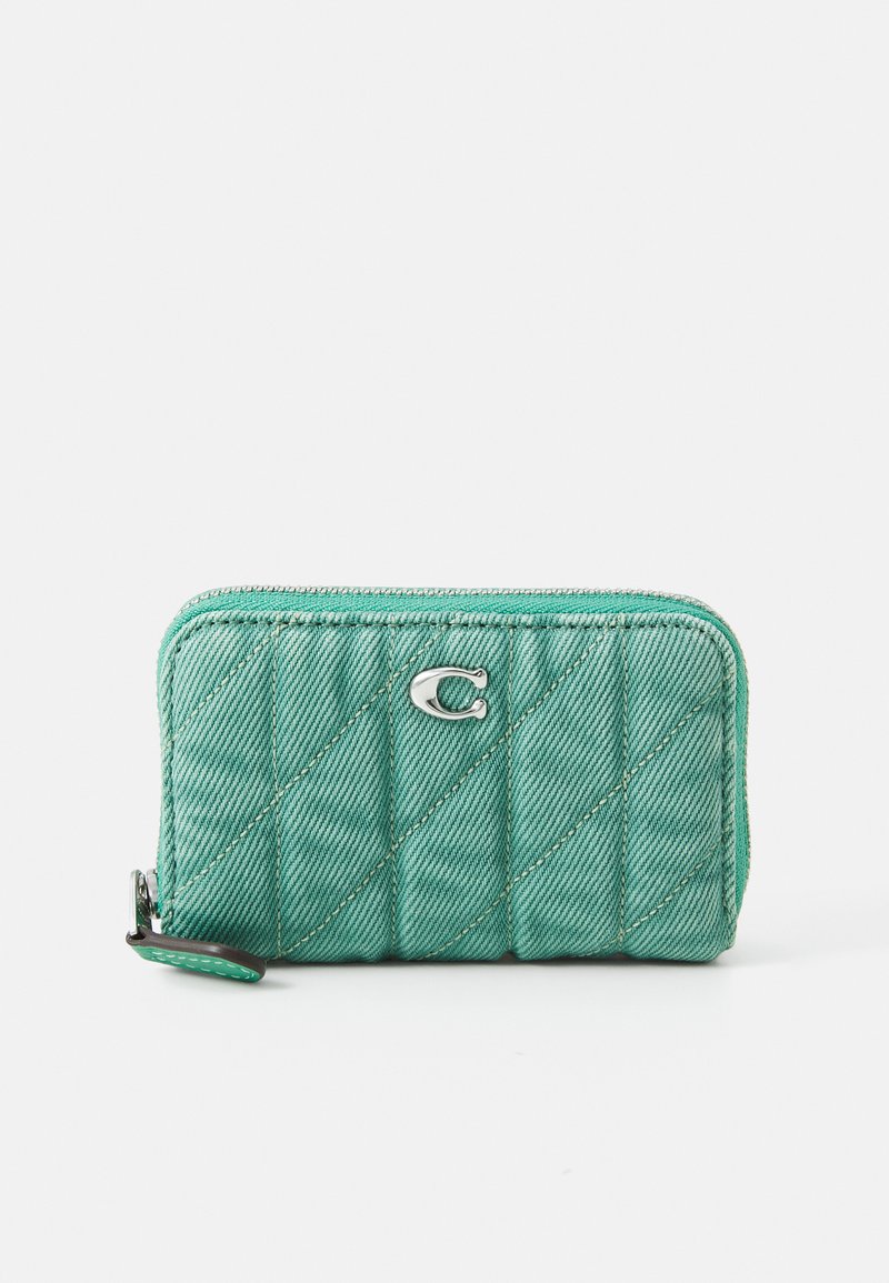 Quilted mint green wallet with silver hardware, diagonal stitching, and a zipper closure. Features a small loop for easy carrying.