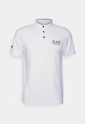White polo shirt with a curved collar, three black buttons, and a printed logo. Features short sleeves and contrasting black accents.