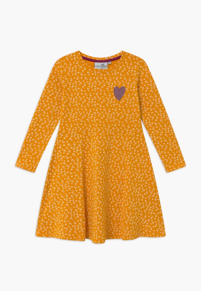 Pitkähihaista oranssia puuvillamekkoa, jossa on kukkakuosi. Rinnassa violetti sydänapplikaatio. Helma on liehukemallinen.