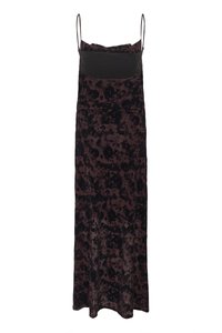 Long, sleeveless dress made of soft, textured fabric in dark brown with a black floral pattern and fitted bodice and flowing skirt.