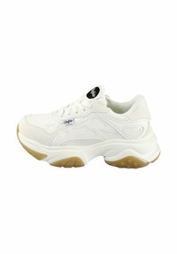 White sneaker with textured leather upper, lace-up closure, and a thick sole featuring a gum rubber accent. Notable design lines on sides.