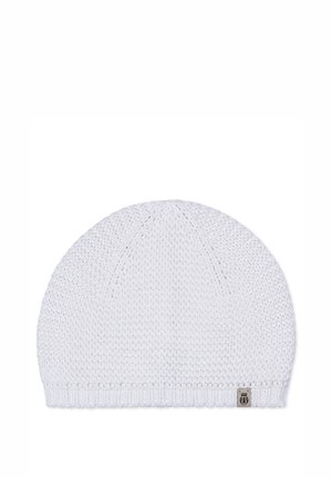 White knitted beanie with a textured pattern and a small rectangular patch near the ribbed edge on a plain background.