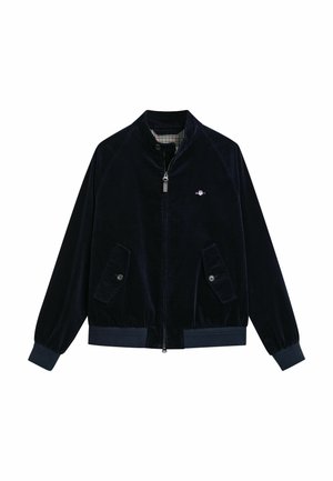 Marineblauwe corduroy jas met een ritssluiting aan de voorkant, staande kraag, twee voorzakken met knopen en geribbelde manchetten. Gevoerd met een geruit patroon.